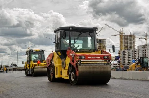 Road rollers compressing asphalt to highway Stock Photos