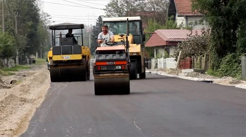 Road rollers flattens asphalt. Paving. Asphalting. Steamrollers. Road work. Stock Footage 41720933