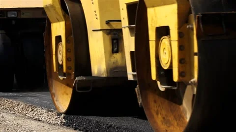 Road rollers flattens asphalt. Steamrollers smoothing asphalt. Close up. Stock-Footage 41740877