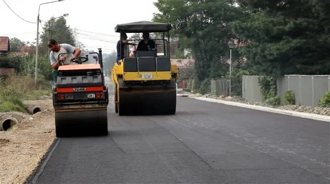 Road rollers. Steamrollers smoothing asphalt. Asphalting. Tracking shot.Close up Stock Footage 41728414