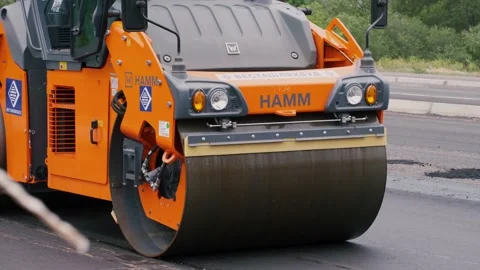 Road rollers working on a city street. Heavy industrial machinery Stock Footage 132523929