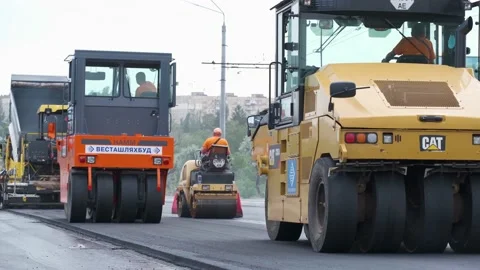 Road rollers working on city street. industrial machinery on road construction Video stock 133107622