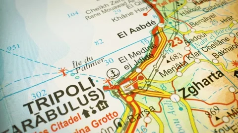 Road route leading to Tripoli, Libya – gliding view over an atlas map Stock Footage 345784571