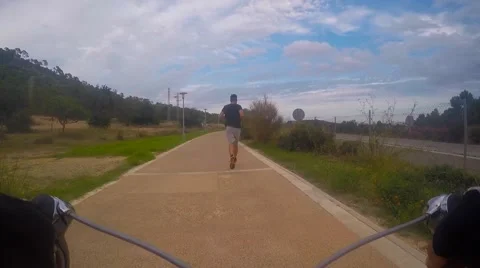 Road runner from back filmed from riding bike Video stock 54921976
