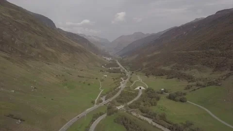 The road runs between the mountains. Stock Footage 149107494