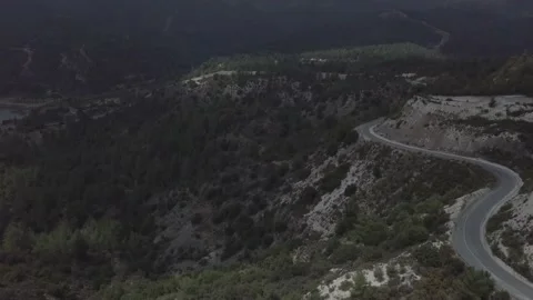 The road runs at the edge of the mountain. Stock Footage 149107885