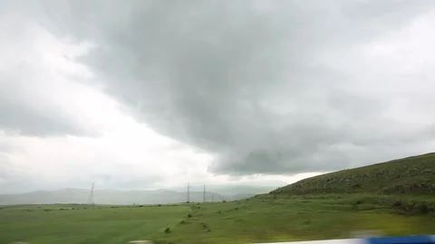 A road runs through green fields 6 Stock-Footage 317341227