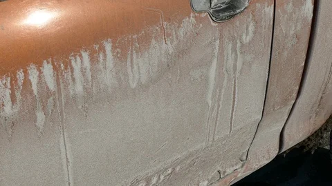Road salt after long cold winter takes it's toll on cars and trucks Stock Footage 104234173