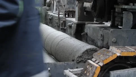 Road screed paver, roller or vibrator flattening concrete layer Stock Footage 158049429