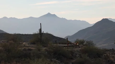 Road With Sharp Curve In Desert Cactus Mountain Setting 스톡 동영상 148403226