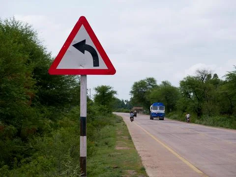 Road side arrow direction triangular shape board Stock Photos