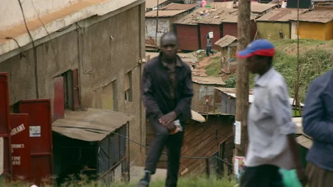 Road side view of crowded street with village in the background Uganda Africa Stock Footage 170872928
