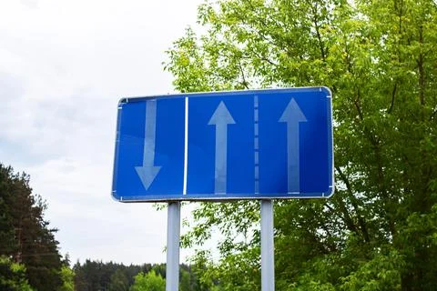 Road sign with arrow pointers close up Stock Photos