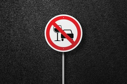 Road sign on a background of asphalt. Stock Photos