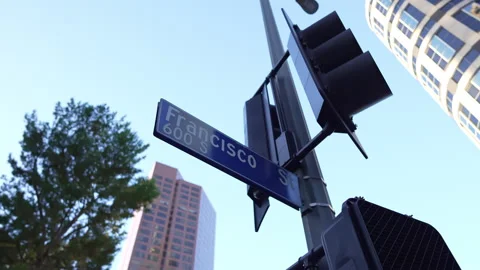 Road sign Francisco St in Down Town with office buildings Stock Footage 256381491