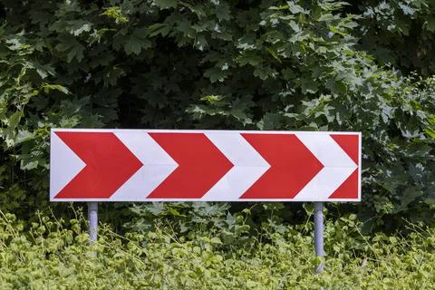 A road sign installed on the road to regulate traffic Stock Photos