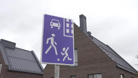 Road sign marks zone prioritizing pedestrians and children 動画素材 303107663