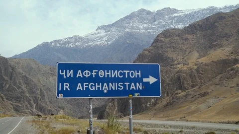Road sign pointer to afghanistan Stock Footage 123560477