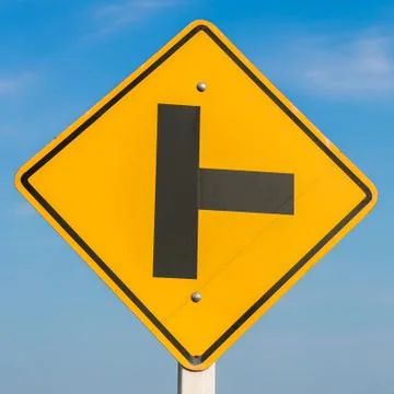 Road sign on sky background,junction sign,intersection, crossroad. Stock Photos