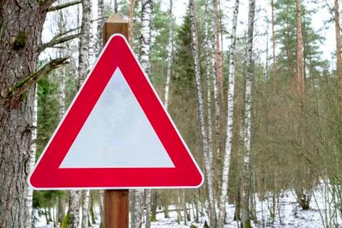 Road sign triangular shape. Red with white attention traffic sign. Stock Photos