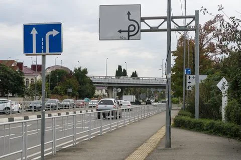 Road signs with pointers against a cloudy sky. Stock Photos