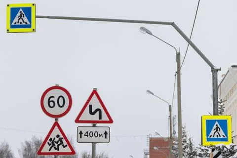 Road signs stand side by side. a sign Overtaking is forbidden, the speed limit Stock Photos