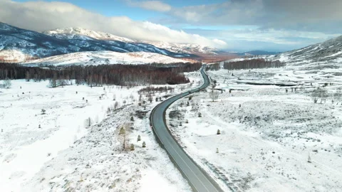 Road in the snow-covered mountains Stock Footage 152089668