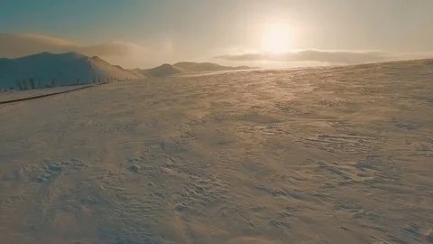 Road by the snow field at the dusk. Stock Footage 70381424