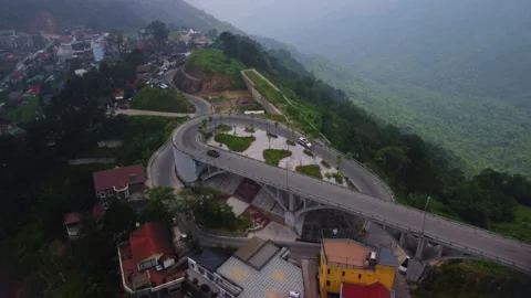 A road spiral in a mountainous area Stock Footage 243373583