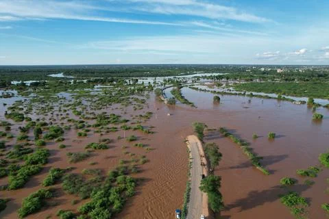 Road split by floods Stock Photos