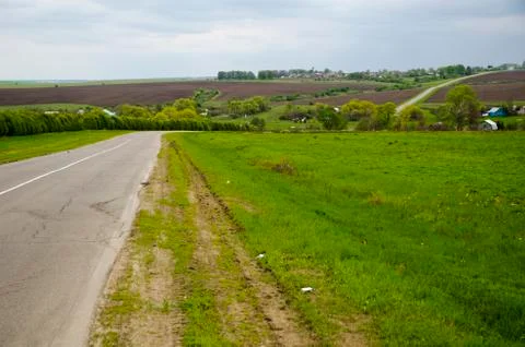 Road in the spring countryside Stock Photos