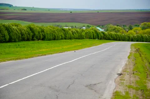 Road in the spring countryside Stock Photos