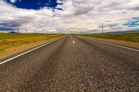 Road steppe sky Stock Photos