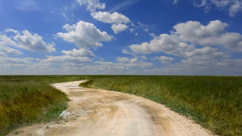 Road in a steppe time lapse scene Stock Footage 266128656