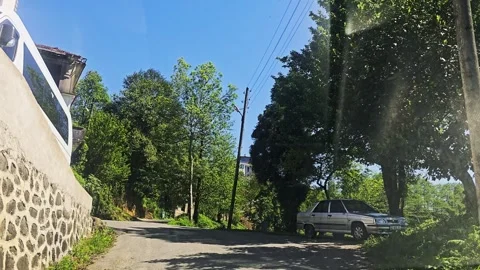 Road with a stone wall and a. Stock Footage 282849008