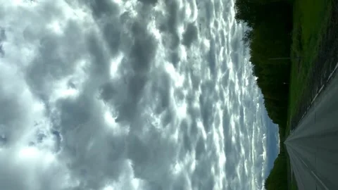 Road with storm clouds in summer. trees flicker. video Video stock 194028060