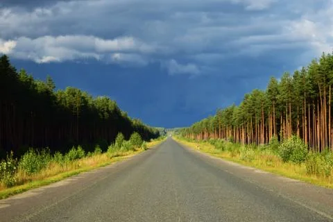 The road stretches into the distance. Stock Photos
