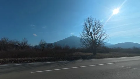 Road stretches before distant. Balkan, Eastern Europe, POV Vídeo Stock 331455333