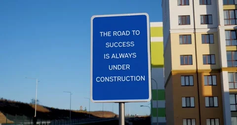 The Road To Success Is Always Under Construction Road Sign on Clear Blue Sky Stock Footage 272165080