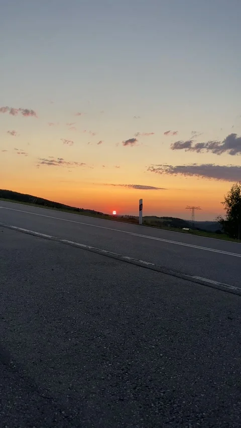 Road at Sunset – Tranquil Evening Drive Stock Footage 303169464