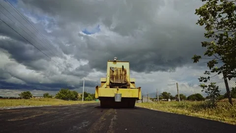 Road surface repair.  The roller levels and compacts the asphalt. Stock Footage 151536739