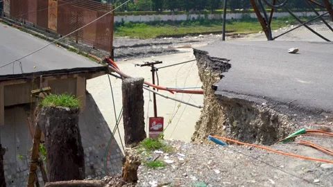 Road surface uplifted by earthquake Stock Footage 321041905