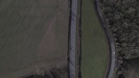 Road surrounded by green landscape Stock Footage 231174814