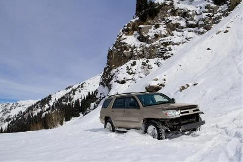 Off-Road SUV Buried in Deep Mountain Snow During Winter Expedition Stock Photos