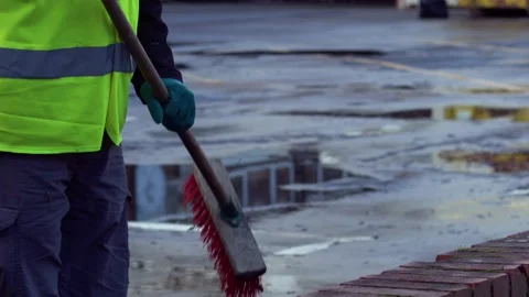 Road sweeper using a broom to sweep road Stock Footage 232989034
