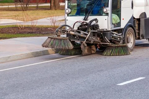 Road sweeper working on a spring day Stock-Fotos