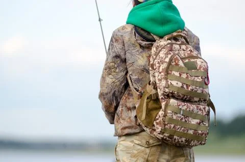 Road tactical backpack coloring worn on the back of the Yakut girls-tourist Stock Photos