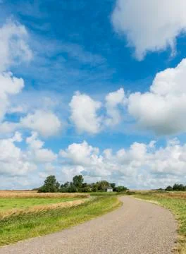 Road on texel with clouds Stock Photos