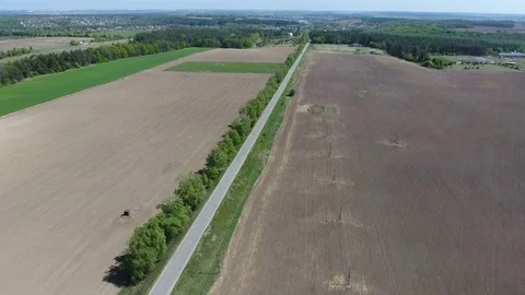 Road through agricultural fields. Aerial view Stock Footage 75192004