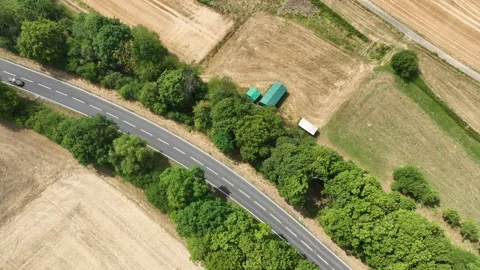 Road through agricultural fields Stock Footage 340149748